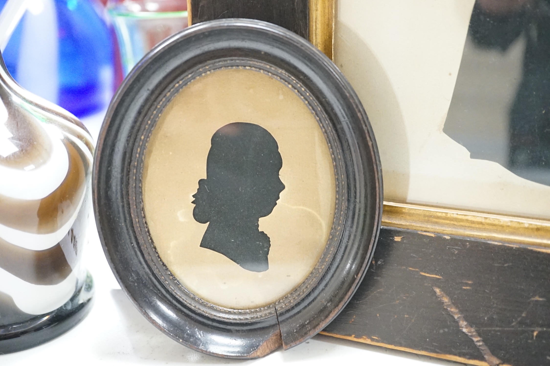 An oval silhouette dated on reverse 1777 together with a larger later silhouette-25cms high x 19cms wide